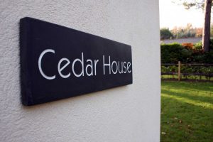 Cedar House name on side of building