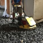 Putting down recycled foam glass insulation for limecrete flooring in St Buryan Cornwall
