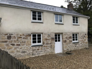 Lime rendering over cob Helston