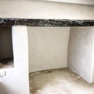 Lime plastering fireplace