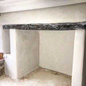 Lime plastering fireplace