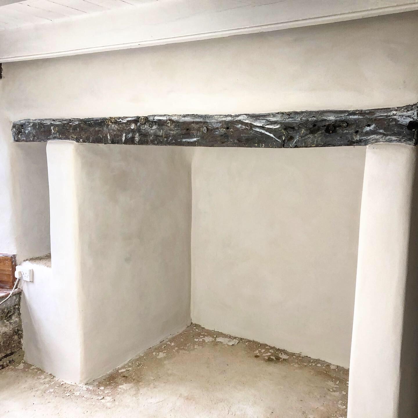 Lime plastering fireplace