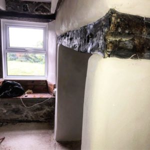 Lime plastering fireplace